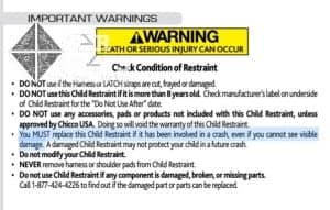 A car seat manual stating clearly the restraint must be replaced after any crash