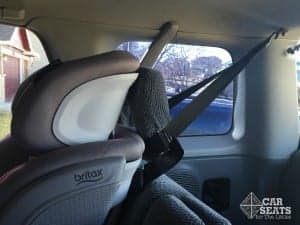 Side view of Britax Advocate installed forward facing showing the tether attached to a ceiling anchor and the tether bundled away