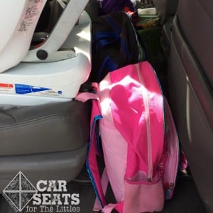 Storing items on the car floor in front of a rear facing car seat