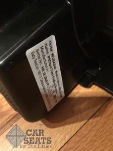 The date of manufacturer sticker on the bottom of the folded booster. 