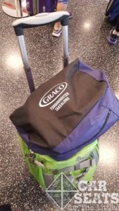 Graco TurboBooster TakeAlong fits onto my carryon luggage