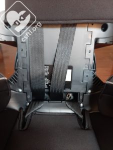 Converting the MyFit to booster mode: store the chest clip and harnes in the compartment