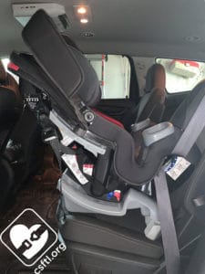 Baby Trend Cover Me installed with the vehicle seat belt