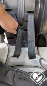 Remove the car seat cover to expose the belt path
