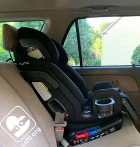Nuna EXEC forward facing with the vehicle seat belt