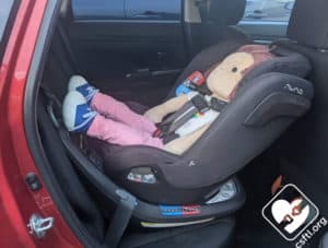NUNA REVV rear facing most reclined 16 month old doll