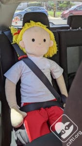 Diono Solana 2 6 year old doll with shoulder belt guide adjuster