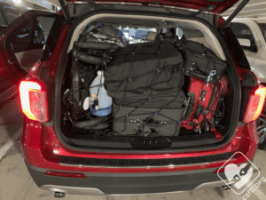 A full trunk with the luggage secured